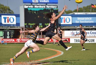 Ilett leaps to mark the ball against Sydney Uni