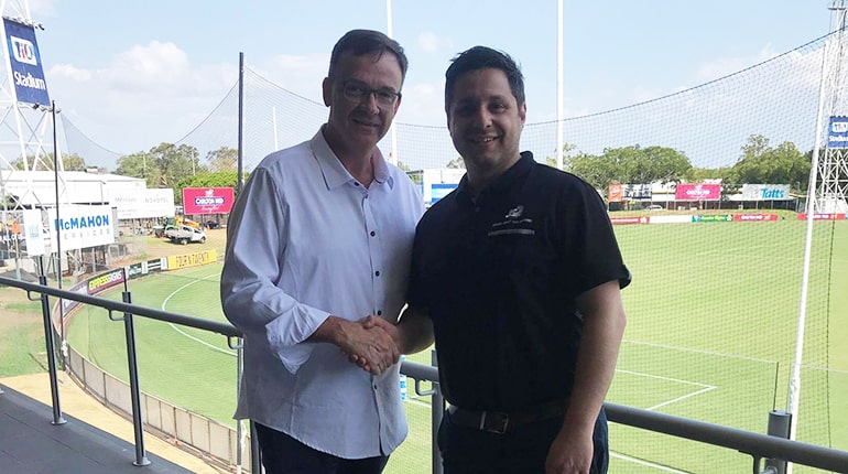 AFLNT CEO Michael Solomon and JS Sports Operations Manager shaking hands
